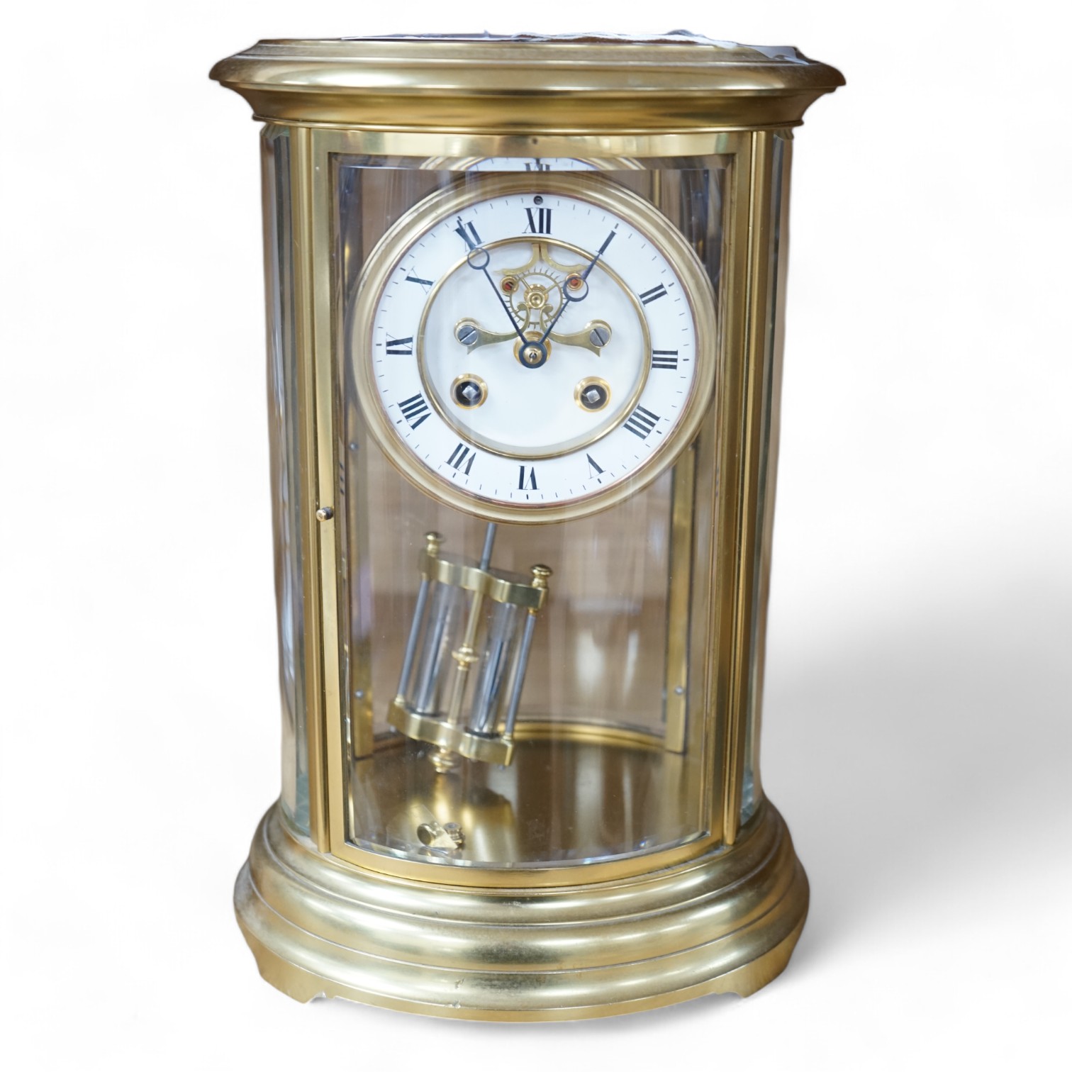 A 19th century French gilt brass oval four glass mantel clock with Brocot escapement, 30cm high. Condition - good